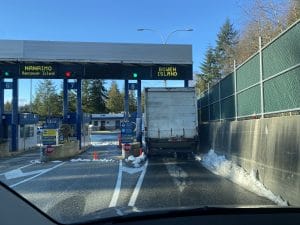 a truck is in line for the bowen island ticket window to purchase a ticket from Horseshoe Bay to Bowen Island.