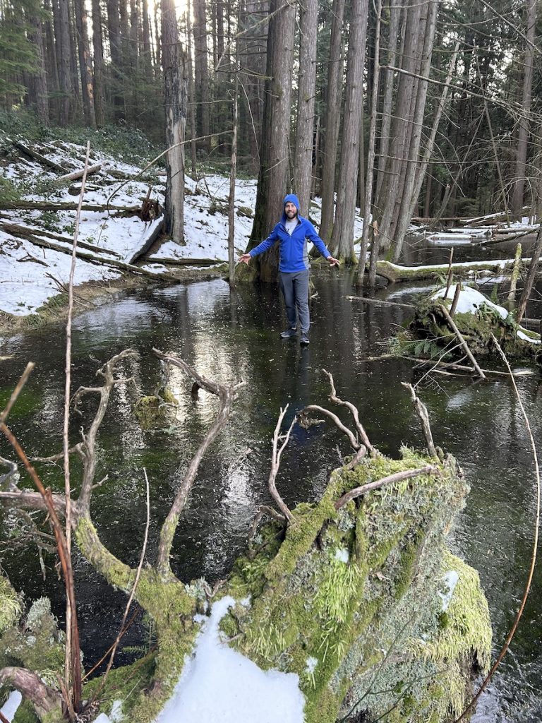 The author, Brendan, standing on a frozen pond on mount collins on bowen island during the winter time. 