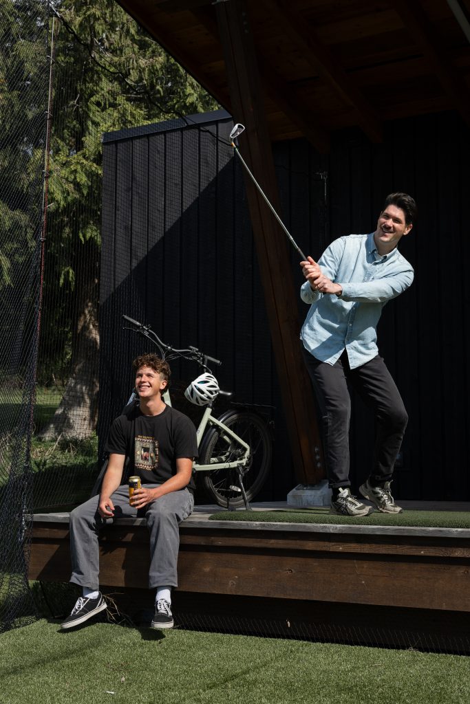 ebikers at driving range at Bowen Golf Club on Bowen Island; laughing so hard their friends won't believe it.